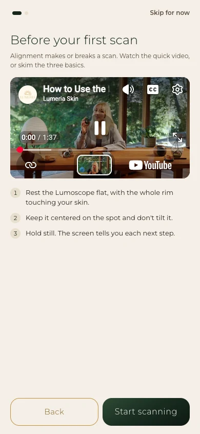 Lumeria app screen titled Before your first scan: the Lumoscope tutorial video, then three numbered tips to rest the Lumoscope flat, keep it centered and hold still, with Back and Start scanning buttons.